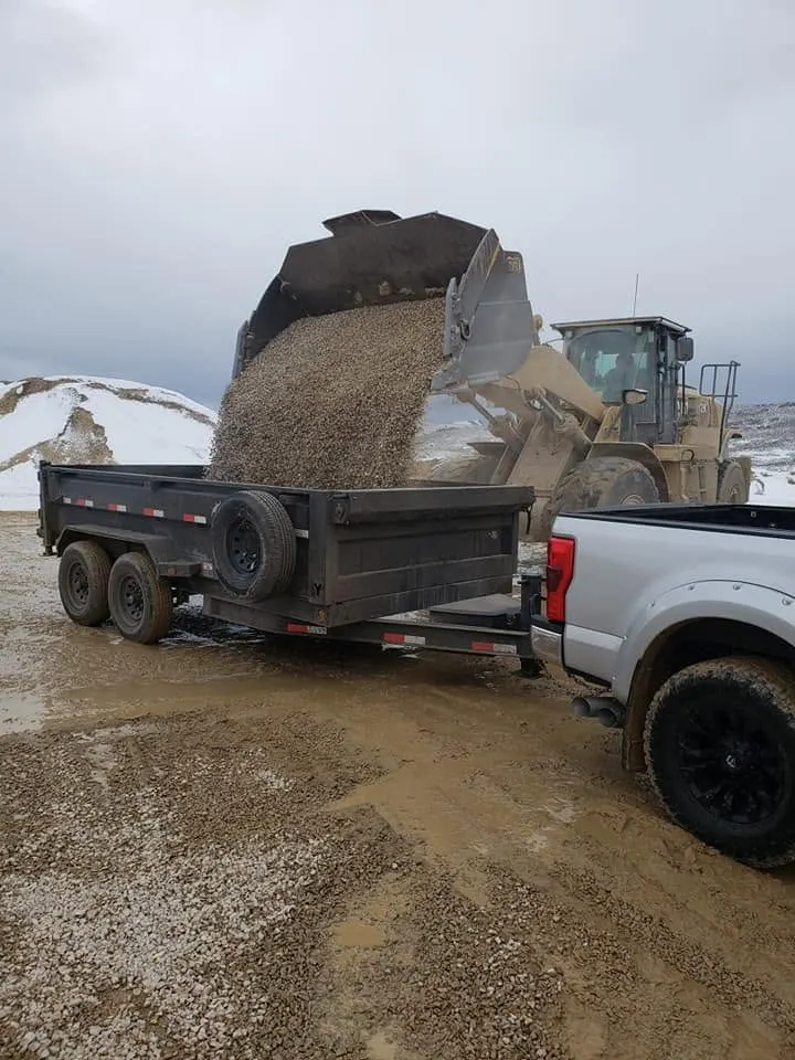Wasatch Demolition loader hauling gravel on a Wasatch Back construction site